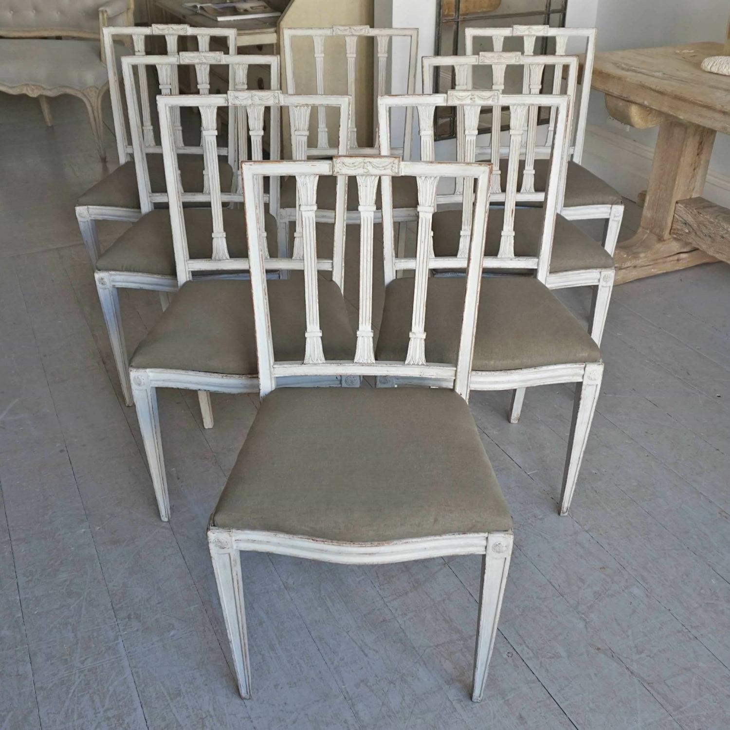 SET OF EIGHT RICHLY CARVED GUSTAVIAN STYLE DINING CHAIRS