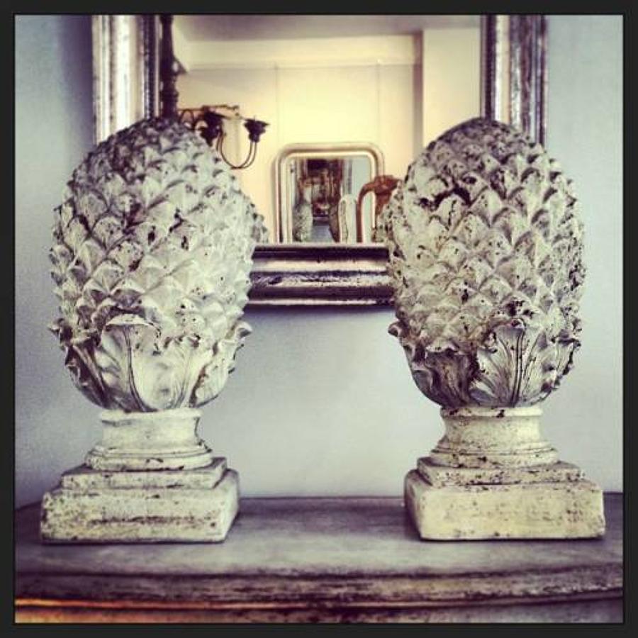 PAIR OF COMPOSITE STONE PINEAPPLES